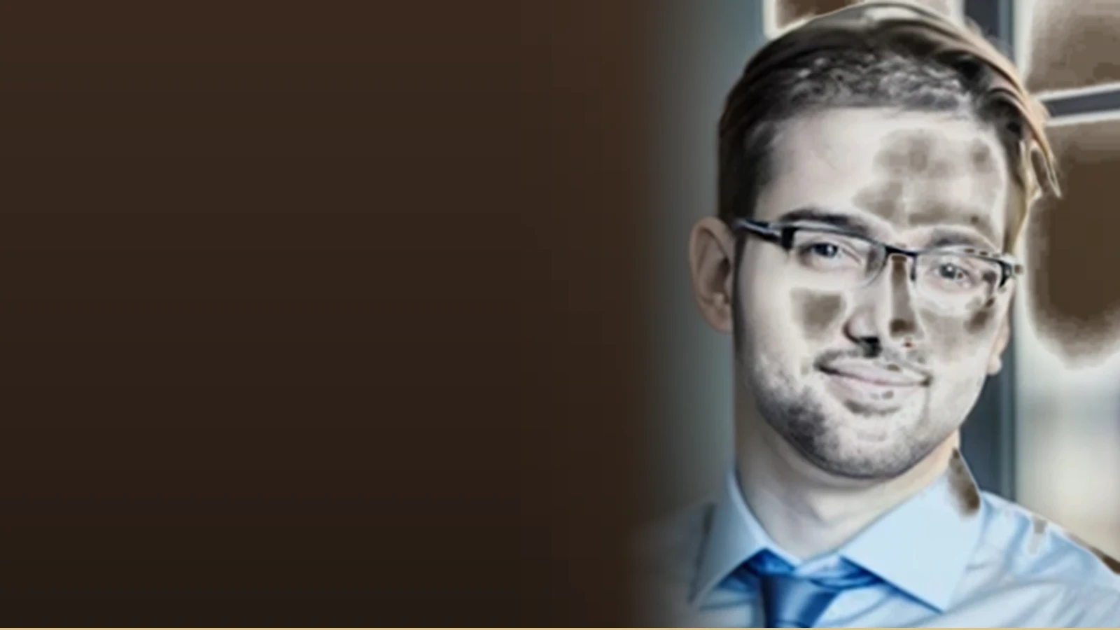 Gourav Sharma, an instructional designer, smiles at the camera wearing glasses and a blue tie.